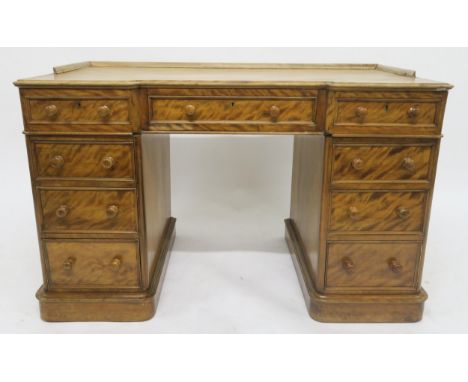 A VICTORIAN MAHOGANY HOBBS &amp; CO INVERTED BREAKFRONT TWIN PEDESTAL DESK with central drawer flanked by banks of four drawe