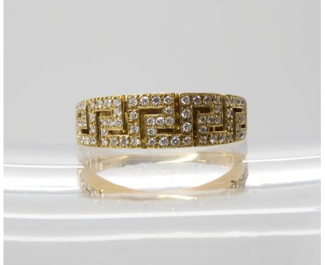 AN 18CT GOLD KEY PATTERN DIAMOND RING made by Italian designer Leo Pizzo, finger size P, weight 5.6gms, shank stamped 750. In