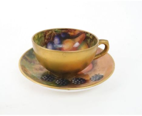A ROYAL WORCESTER FRUIT DECORATED DEMITASSE CUP AND SAUCER the cup painted with pears and grapes, signed by E Phillips, the s
