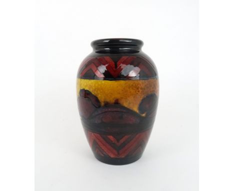 A WILLIAM MOORCROFT (1872-1945) FLAMBE DAWN PATTERN VASE with panel of trees flanked with bands of chevrons, impressed and pa
