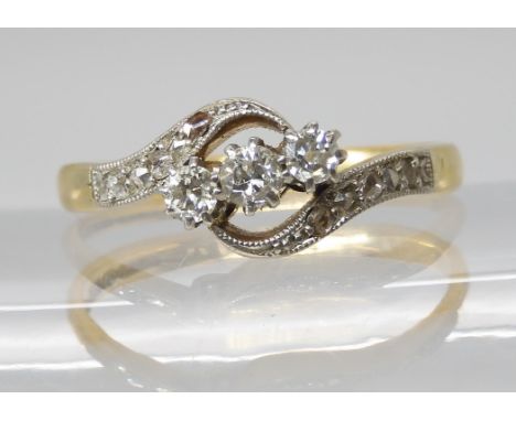 A VINTAGE 18CT &amp; PLATINUM THREE STONE DIAMOND RING set with estimated approx 0.20cts of old cut and rose cut diamonds set