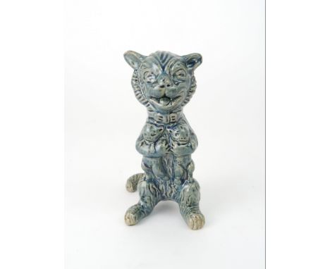 A DUNMORE POTTERY MODEL OF A CAT holding kittens, 11.5cm high Condition Report:A small chip to the glaze on the underside of 