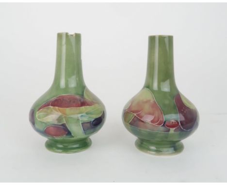 WILLIAM MOORCROFT (1872-1945) A PAIR OF CLAREMONT PATTERN VASES of squat baluster bottle form, decorated&nbsp;with toadstools