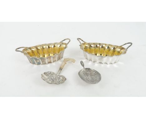 A GEORGE III SILVER CADDY SPOON the bowl in the form of a shell with chased floral decoration and mother of pearl handle, by 