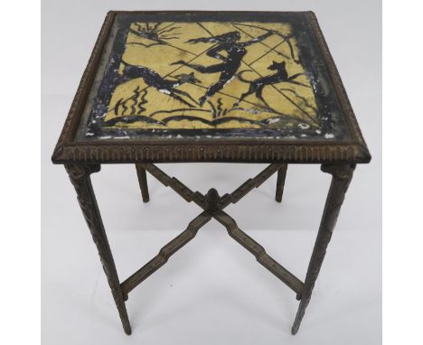 AN AMERICAN CAST IRON ART DECO SIDE TABLE with a glass inset top depicting Diana the huntress on four cast legs depicting mon