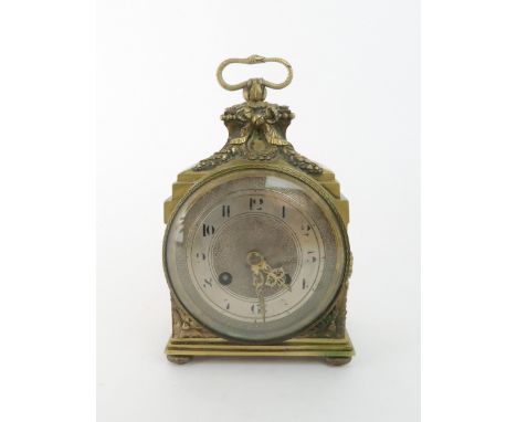 A FRENCH BRASS MANTLE CLOCK&nbsp; with silvered dial, chiming on the quarter, with laurel wreath decoration and snake handle,
