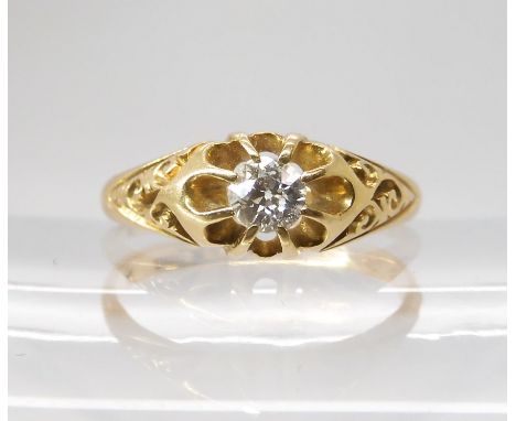 AN 18CT GOLD EDWARDIAN SOLITAIRE DIAMOND RING set with an estimated approx 0.20cts, with scrolled mount, hallmarked Chester 1