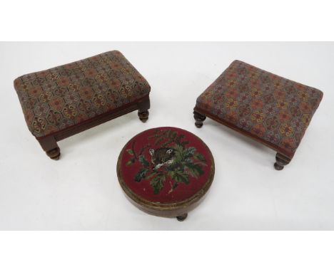 A SMALL VICTORIAN MAHOGANY FRAMED UPHOLSTERED FOOTSTOOL with turned feet, a Victorian mahogany framed footstool and a Victori