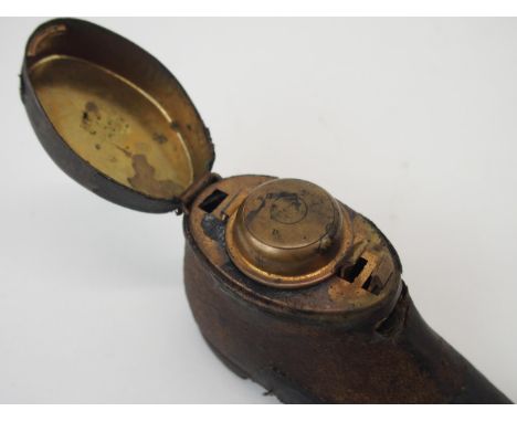 A NOVELTY TRAVEL INKWELL MODELLED AS A LADY'S SHOE with hinged lid, 9cm long x 5cm high, three leather travel inkwells Condit