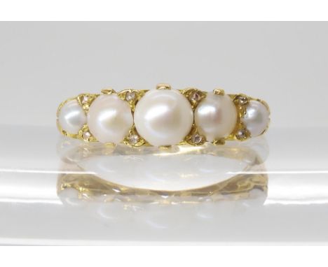 A VICTORIAN PEARL & DIAMOND RING set with five half pearls the largest diameter 5.5mm, with the claws set with rose cut diamo