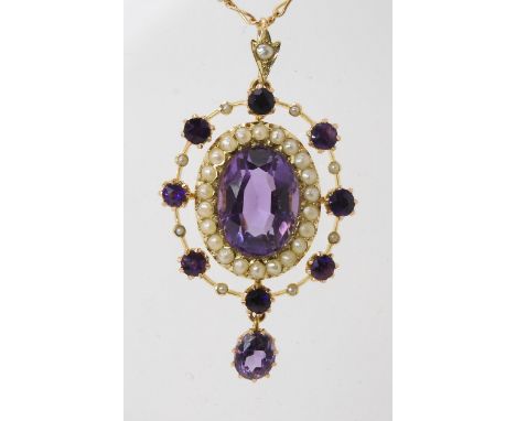A 15CT GOLD EDWARDIAN PENDANT set with amethyst and pearls, the central amethyst is approx 13.5mm x 10mm, length of pendant w