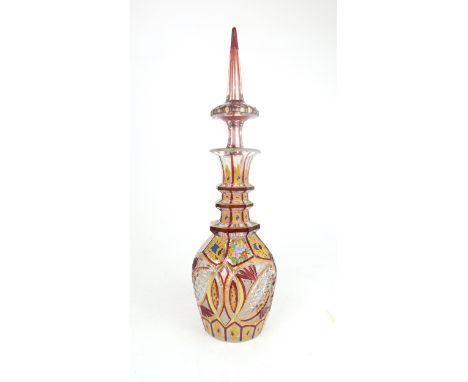 A BOHEMIAN CUT AND ENAMEL PAINTED DECANTER with flower and scroll decoration, 45.5cm high Condition Report:"stopper has small