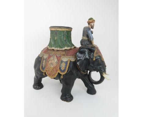 A LARGE CERAMIC FERDINAND GERBING ELEPHANT AND RIDER PLANTER painted in colours and with paste gem detail, marked FGW to base
