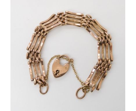 A 9CT GOLD GATE BRACELET stamped 9c to the 'gates' and the heart shaped clasp. Length 20cm, weight 17.1gms Condition Report:T