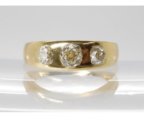 AN EARLY HAMILTON &amp; INCHES THREE STONE RING gypsy set with estimated approx 0.75cts of old cut diamonds. inner shank stam