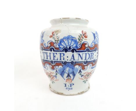 AN ENGLISH DELFT DATED POLYCHROME DRUG-JAR of typical shape, painted in blue, green and iron-red, named THER:ANDR: within an 