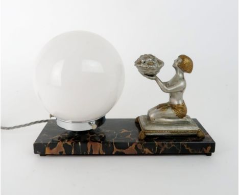 AFTER ENRIQUE MOLINS-BALLESTE (1893-1958) An Art Deco table lamp modelled as a kneeling girl holding aloft a basket of flower