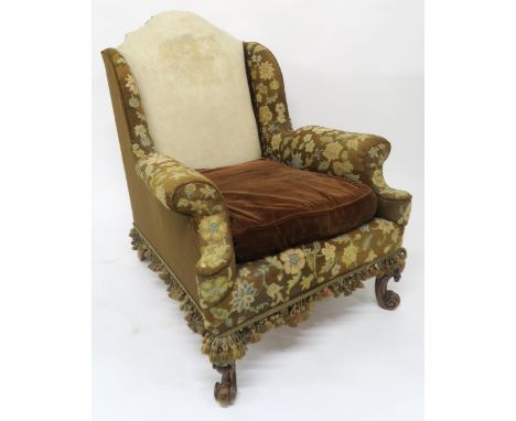 AN EARLY 20TH CENTURY HOWARD & SONS GEORGIAN STYLE WINGBACK ARMCHAIR stamped "19762005 HOWARD & SONS Ltd BERNERS ST" to back 