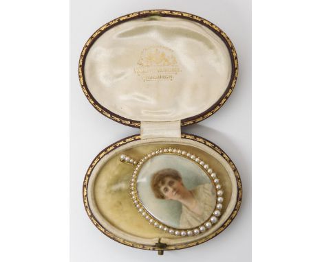 A DOUBLE SIDED PORTRAIT MINIATURE LOCKETstamped 15ct to the bail, the portrait of a lady surrounded by split pearls. The port