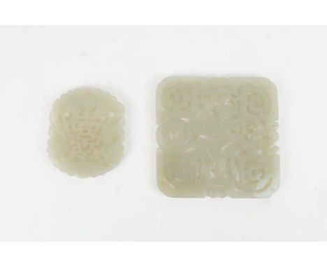 A CHINESE JADE MEDALLION each side carved with two figures amongst foliage and scroll elements, 7.5 x 7.5cmm and another smal