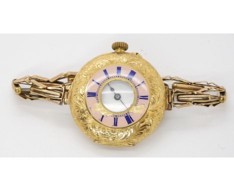 AN 18K GOLD HALF HUNTER WRISTWATCH the decorative pink guilloche enamel chapter ring with blue enamel Roman numerals and all 