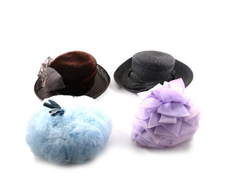 A collection of vintage hats and hat boxes, to include a large black straw hat with black ribbon and pink flower by Frederiek
