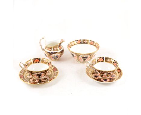 A Royal Crown Derby Imari design teaset, 1128 pattern, comprising 7 cups, 6 saucers, 7 plates, milk jug, sugar bowl and cake 