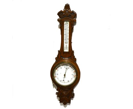 Carved oak aneroid wall barometer, opaque dial, signed J. G. Field, Kettering, thermometer over, 91cm.