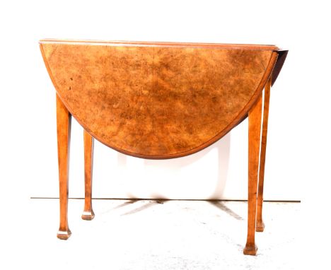 Burr walnut dropleaf table, oval top with moulded edge, square tapering gate legs, 121x93cm, height 76cm.