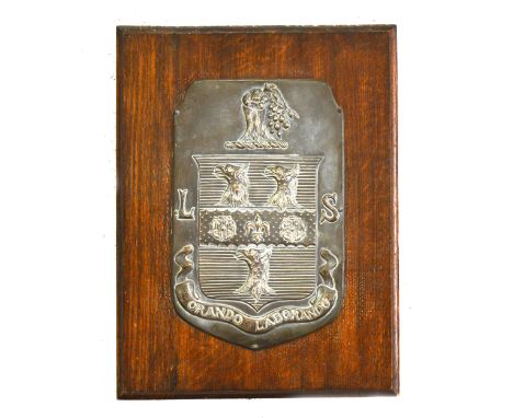 Rugby School interest; a silver plated panel with the School Arms, with the motto Orando Laborando, 32x20cm, mounted on an oa