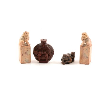 Chinese cinnabar flask shape snuff bottle, lacking lid, carved decoration with figures in a landscape, 7cm; two carved soapst