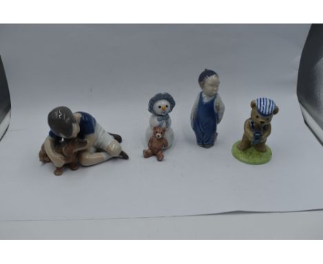 Three Royal Copenhagen figures, Boy with Dog 1502, Boy 3250 and Snow Baby with Teddy Bear 019 along with a similar Bing &amp;