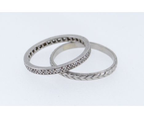 TWO PLATINUM RINGS comprising wedding band of arrow head design together with platinum and diamond eternity ring, ring size Q