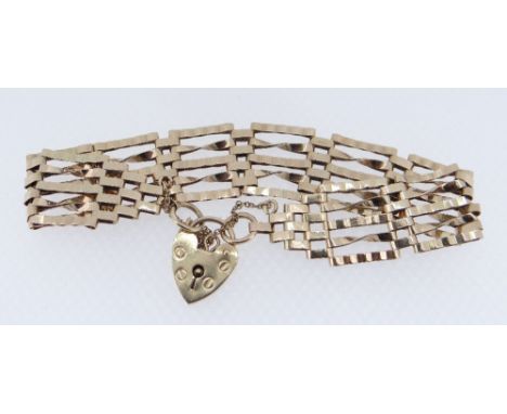 9CT GOLD FIVE-BAR GATE BRACELET, heart shaped padlock, 11.8gms