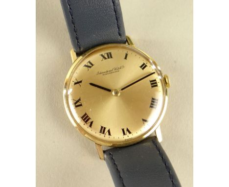 9CT GOLD IWC GENTS WRISTWATCH, the dial marked 'International Watch Co Schaffhausen' with Roman numerals, engraved to back co