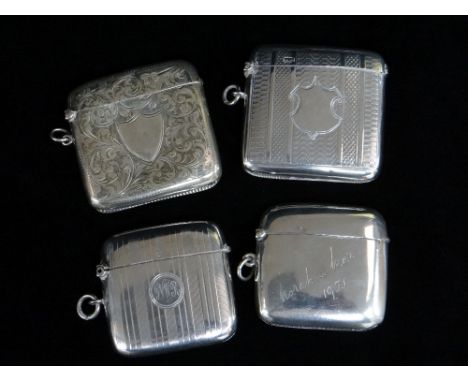 FOUR SIMILAR SILVER VESTA CASES, of slightly curved form, two engine turned, one scroll engraved, the other with names and da
