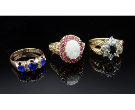 THREE 9CT GOLD RINGS comprising sapphire &amp; diamond chip ring (size O), opal &amp; ruby ring (size M), and a sapphire and 