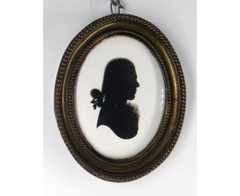 ATTRIBUTED TO HOUGHTON &amp; BRUCE (British fl. 1792-1796) SILHOUETTE PORTRAIT MEDALLION. of a young Georgian gentleman weari