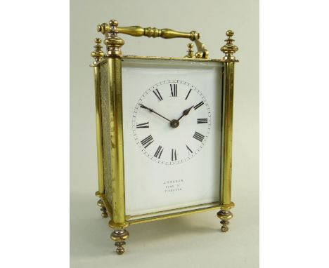 FRENCH BRASS CARRIAGE CLOCK, white enamel Roman dial with retailer 'J. Craven, Fore St, Tiverton', floral scrolling cast side