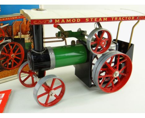 MAMOD T.E.1A LIVE STEAM TRACTOR, with booklet, steering rod, spirit funnel, burner and box, 26cms long Condition: engine exce