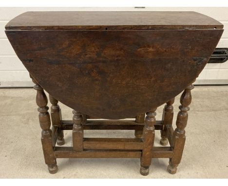  A Victorian drop leaf, gate leg table with turned legs and peg joints.  Drawer missing.  Approx. 68cm tall x 72 cm unextende