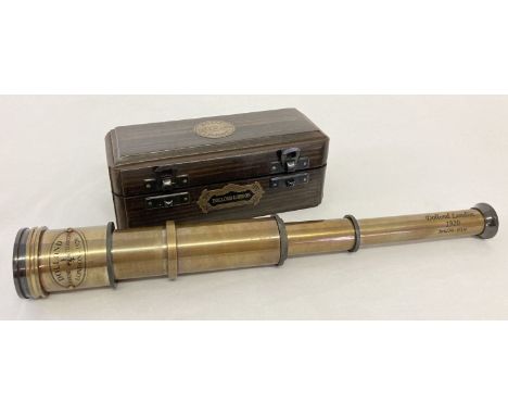 A 4 drawer brass marine telescope, marked "Dolland, London" in a dark wood box.   Box approx. 17cm long.