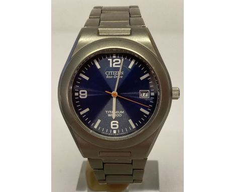 A Citizen Eco Drive Titanium automatic wristwatch with stainless steel case and strap. Blue face with seconds hand and date f