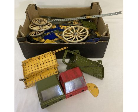 A box of assorted vintage Meccano. To include wheels and plates in varying sizes.  