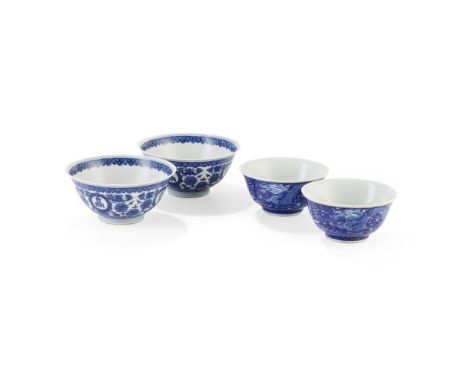 TWO PAIRS OF BLUE AND WHITE BOWLS KANGXI AND QIANLONG MARK 康熙款 青花留白雙龍趕珠紋 及 乾隆款 青花'山高水長'八寶紋碗（兩對） comprising: a pair of bowls e