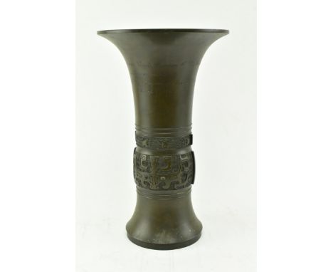 An early 20th century 1910 Japanese bronze presentation trumpet vase. The vase with inscription Presented to Messrs Edwin Gum