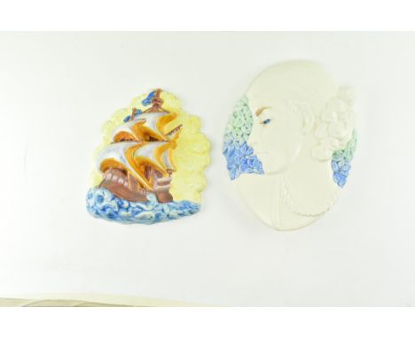 Beswick - two vintage mid 20th century ceramic wall plaques. One plaque depicting a galleon ship, the other a lady's face. Th