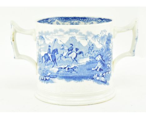 A 19th century Staffordshire ceramic blue and white twin handled loving cup. The cup featuring transfer printed design featur