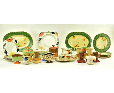 A collection of early 20th century circa 1930s Art Deco decorative ceramic pieces. The lot comprising two serving platters an