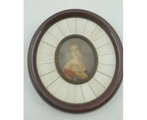 EUROPEAN SCHOOL A miniature portrait of a young woman, wearing a red dress, oval mounted within a lacquer frame with brass su